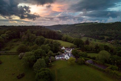 an aerial view of a house in a field at Higher Mapstone - A true retreat nestled in a private sanctuary on Dartmoor in Newton Abbot
