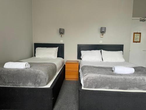 Postel nebo postele na pokoji v ubytování Citi Hotel Aberdeen