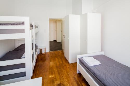 Ένα ή περισσότερα κρεβάτια σε δωμάτιο στο SecondHome Stuttgart - Very nice apartment near historic city centre at Blumenstr 58 in Esslingen am Neckar - W2