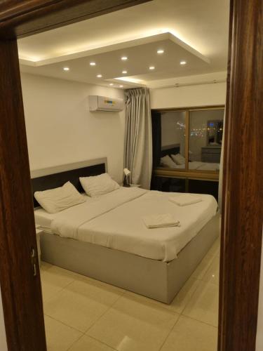a bedroom with a large bed in a room at 2bedroom aprt at 7th circle f-r1 in Amman