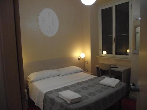 Postel nebo postele na pokoji v ubytování Hotel Elide