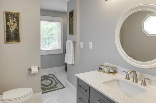 a white bathroom with a sink and a mirror at Lebanon Retreat Decks, Fire Pit and Yard in Lebanon
