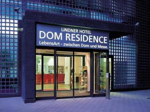 a building with a sign that reads dont residence at Lindner Hotel Cologne Am Dom, part of JdV by Hyatt in Cologne