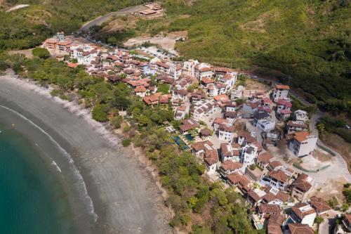 an aerial view of a village next to the ocean at Las Catalinas - Studio Cazenovia centrally located, short walk to beach in Playa Danta