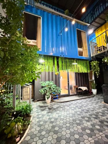 a building with a courtyard with plants in it at Phúc Đạt Container in Vung Tau