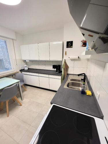 a kitchen with a sink and a counter top at Haus Traudel in Overath