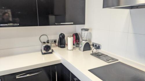 a kitchen with a counter top with a blender at Piso de Lujo en Salinas in Salinas