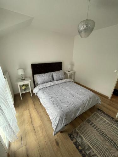Postel nebo postele na pokoji v ubytování Superbe appartement au calme avec vue sur le Lac.