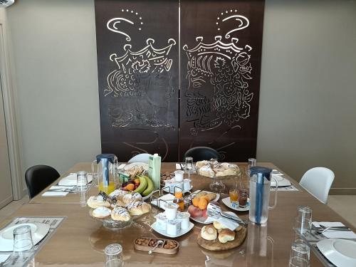 a table with a bunch of food on it at B&B Sbarco dei 1000 Marsala in Marsala