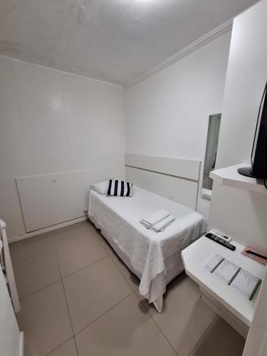 Ein Bett oder Betten in einem Zimmer der Unterkunft Hotel Hospedagem Palhoça