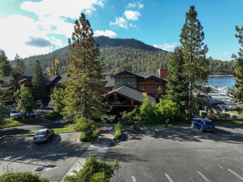 an aerial view of a resort with a parking lot and a lake at The Pines Resort & Conference Center in Bass Lake