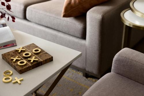a living room with a table and a couch at Crowne Plaza Toronto Airport by IHG in Toronto