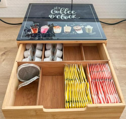 a wooden box filled with different types of ties at Charmant Logement Brugelette Proche de Pairi Daiza in Brugelette