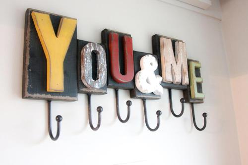 a sign that says yuppie hanging on a wall at The Five Dials Inn in Ilminster