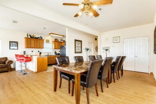 a dining room and kitchen with a table and chairs at Banana Cabana - Quick Walk to Beach & Restaurants in Surfside Beach