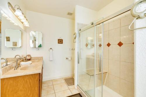 a bathroom with a shower and a sink at Banana Cabana - Quick Walk to Beach & Restaurants in Surfside Beach