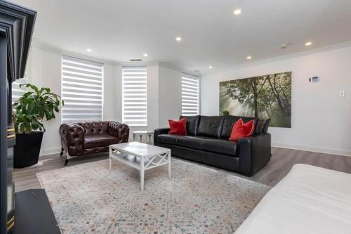 a living room with a couch and a coffee table at 2BR Downtown Apartment in Toronto Close to Eaton Centre in Toronto
