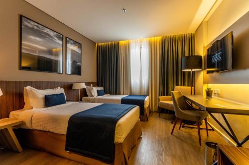 Ένα ή περισσότερα κρεβάτια σε δωμάτιο στο Royal Palm Tower Indaiatuba
