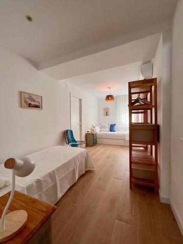 Ένα ή περισσότερα κρεβάτια σε δωμάτιο στο Piso con Mucho Encanto
