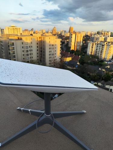 a surfboard on a table on top of a city at Soft Life Crib in Lavington - Dine, Wine & Relax in Nairobi
