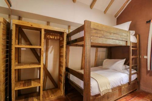 a bedroom with two bunk beds in a room at Divine 3BR House in Valle Sagrado in Calca
