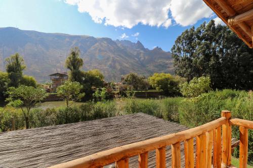a deck with a view of the mountains at Divine 3BR House in Valle Sagrado in Calca