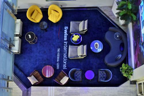 an overhead view of a table with chairs and tables at Swiss International The Vistana Lekki Lagos in Ikota