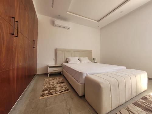 Ένα ή περισσότερα κρεβάτια σε δωμάτιο στο Villa Monika