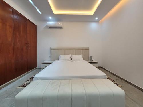 Ένα ή περισσότερα κρεβάτια σε δωμάτιο στο Villa Monika