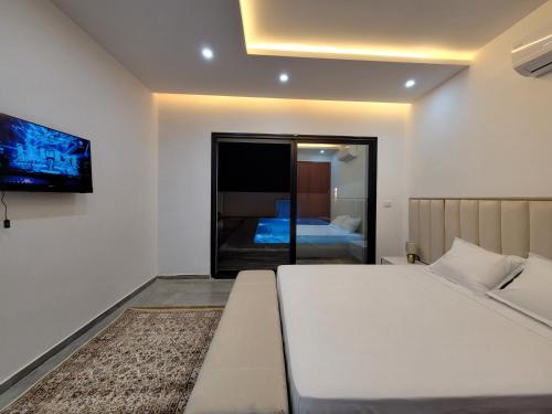 Ένα ή περισσότερα κρεβάτια σε δωμάτιο στο Villa Monika