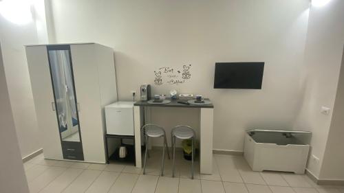 a bathroom with a sink and two stools at marsa in Chiappa