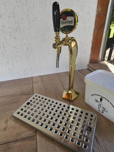 a table with a phone and a metal grate at Relax chalupa Chocenice in Chocenice
