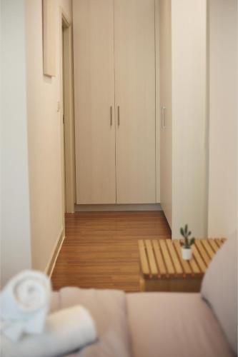 a living room with a couch and a table at Afiniti 2BR Scandinavian Escape - Legoland 300m in Iskandar Puteri