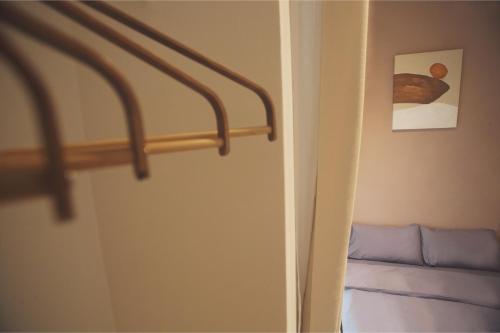 a door with a rail in a room with a bed at Afiniti 2BR Scandinavian Escape - Legoland 300m in Iskandar Puteri