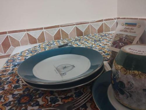 a toilet seat sitting on a counter with a table at La Casina di Tiro in Grotte di Castro