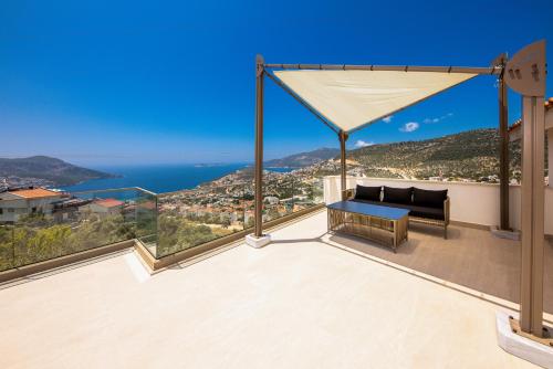 a view of the ocean from the balcony of a house at Villa Casa Che in Kalkan