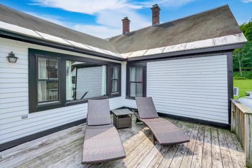 two chairs and a table on a deck at Hawley Home with Deck and Mtn Views Swim, Ski and More! in Hawley