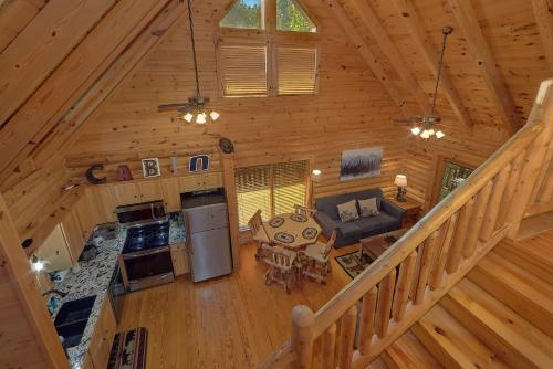an overhead view of a living room and kitchen in a log cabin at Camp Cozy in Pigeon Forge