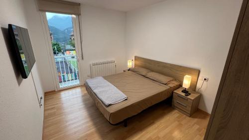 Katil atau katil-katil dalam bilik di Apartament per 6 al Berguedà