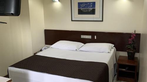 Cama ou camas em um quarto em Cheverny Apart Hotel