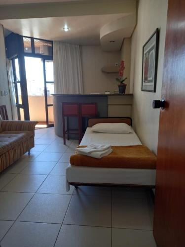Una cama o camas en una habitación de Cheverny Apart Hotel