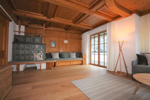 a living room with a couch and a table at Haus Hager Inge in Ellmau
