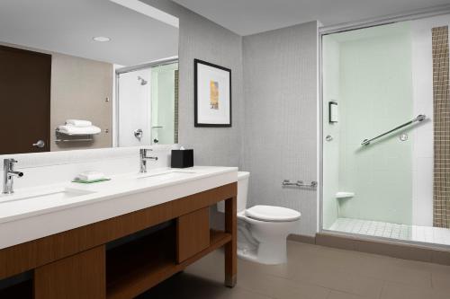 a bathroom with a sink and a toilet and a shower at Hyatt Place Boulder Pearl Street - Newly Renovated in Boulder
