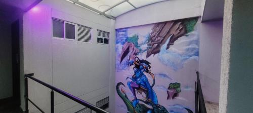 a room with a painting on the side of a wall at Las Aguas Inner Experience in Bogotá