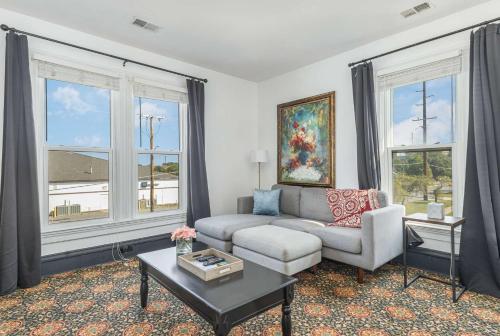 a living room with a couch and a table at Spacious upstairs 1bed- Walking distance to Beach outlet mall in Michigan City