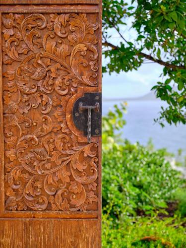 a wooden door with a design on it at The Aerial, BVI in Tortola Island