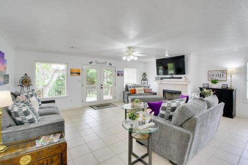 a living room with two couches and a table at Lakefront Hot Springs Condo with Balcony and Fireplace in Hot Springs