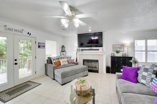 a living room with two couches and a fireplace at Lakefront Hot Springs Condo with Balcony and Fireplace in Hot Springs