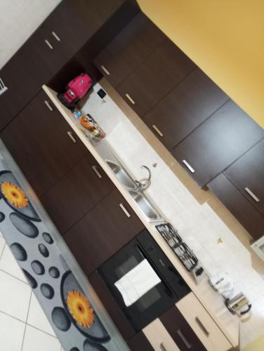 an overhead view of a kitchen with brown cabinets at La Corte dei Morra in Venafro