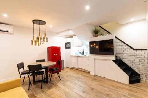 a kitchen and dining room with a table and chairs at Town House Nation, Bastille, AC by LCC Agency in Paris
